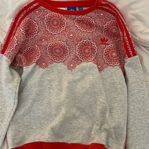 Adidas red and grey patterned sweatshirt.